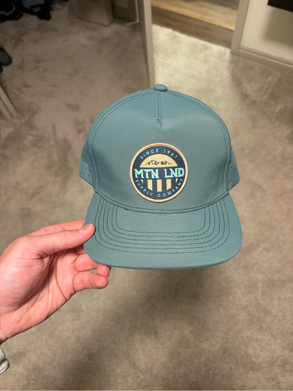 MTN LND Teal Trucker Hat -